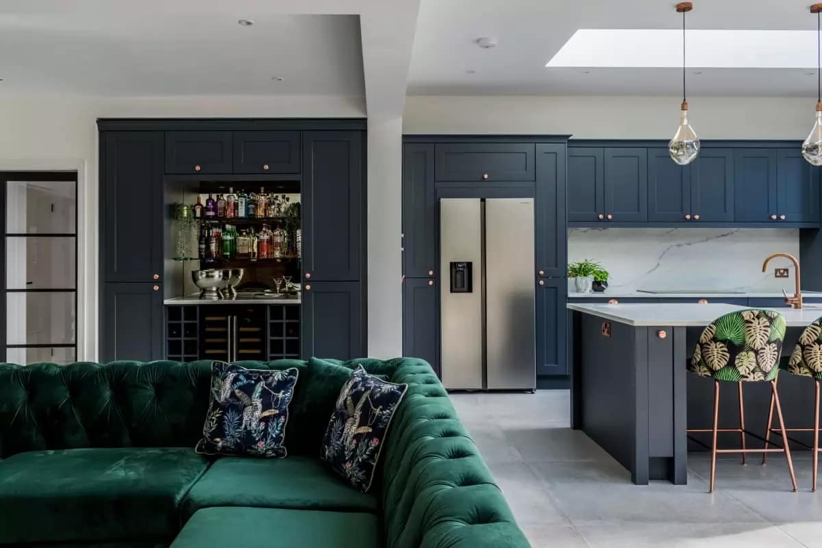Open plan kitchen and home bar Dark blue open plan kitchen and home bar