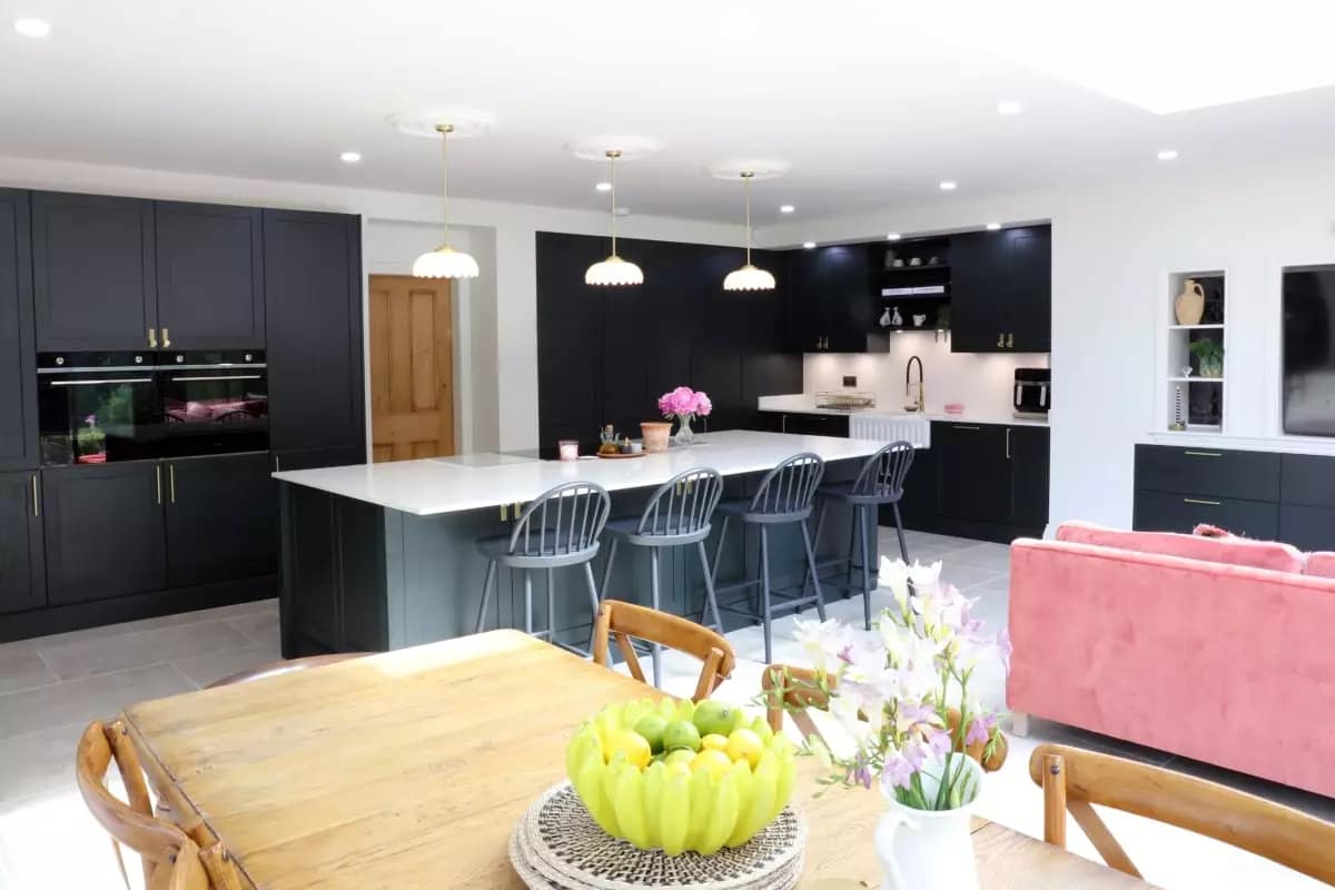 Bespoke open plan kitchen and living area with dining table Bespoke open plan kitchen and living area with dining table